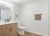 Thumbnail 18 of 45 - a white bathroom with a toilet and a sink