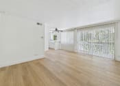 Thumbnail 33 of 50 - A room with wooden flooring and a window with blinds.