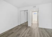 Thumbnail 20 of 85 - an empty room with white walls and wood floors and a sliding glass door