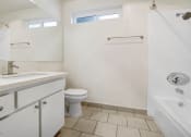 Thumbnail 22 of 85 - a bathroom with a toilet and a sink and a shower