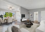 Thumbnail 4 of 23 - A modern living room with a white sofa and a coffee table.
