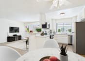 Thumbnail 2 of 15 - A modern kitchen with a dining table and chairs in the foreground.