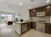 Thumbnail 1 of 45 - a kitchen with stainless steel appliances and a counter top