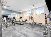 Thumbnail 80 of 95 - A gym with a variety of equipment including treadmills, weights, and exercise machines.