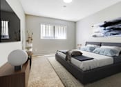 Thumbnail 8 of 15 - A modern bedroom with a large bed and a large painting on the wall.