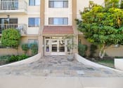 Thumbnail 1 of 6 - the front entrance to the building of the encinitas condominiums
