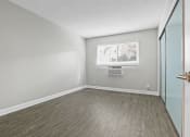 Thumbnail 34 of 64 - an empty room with a window and a door