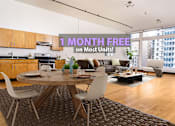 Thumbnail 1 of 38 - A modern living room with a dining table and chairs is on sale for 1 month free on most units.