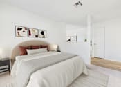 Thumbnail 9 of 115 - A bedroom with a large bed and a white wall.