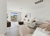 Thumbnail 5 of 115 - A living room with a white couch and a large window.