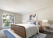 Thumbnail 12 of 33 - A bedroom with a bed, a nightstand, and a painting on the wall.
