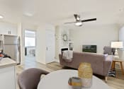 Thumbnail 46 of 66 - a living room with a couch and a table