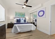 Thumbnail 48 of 66 - a bedroom with a bed and a ceiling fan