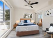 Thumbnail 53 of 66 - a bedroom with a bed and a ceiling fan