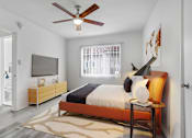 Thumbnail 6 of 26 - A bedroom with a bed, a ceiling fan, and a rug.