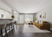 Thumbnail 3 of 32 - A living room with a brown couch and a white chair.
