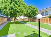 Thumbnail 3 of 14 - Lush Landscaping courtyard with 2 large trees