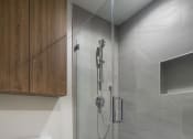 Thumbnail 16 of 16 - a bathroom with a toilet and a glass shower