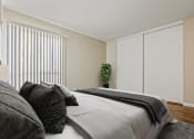 Thumbnail 4 of 11 - a bedroom with a large bed and a window