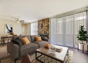 Thumbnail 5 of 11 - a living room with a couch and a coffee table