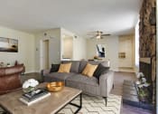 Thumbnail 6 of 11 - a living room with a couch and a coffee table