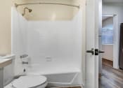 Thumbnail 81 of 83 - a bathroom with a tub and a toilet