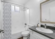 Thumbnail 86 of 95 - a bathroom with a sink toilet and a shower