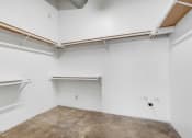 Thumbnail 91 of 92 - an empty room with white walls and concrete floors