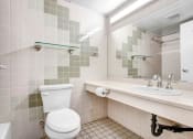 Thumbnail 90 of 92 - a bathroom with a toilet sink and mirror