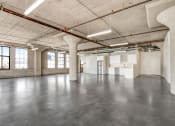 Thumbnail 81 of 92 - an empty warehouse space with concrete floors and white walls