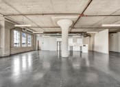 Thumbnail 82 of 92 - an empty warehouse space with a column in the middle of the floor