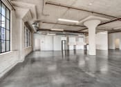 Thumbnail 78 of 92 - an empty warehouse space with concrete floors and white walls