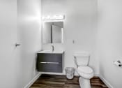 Thumbnail 84 of 92 - a bathroom with a toilet sink and mirror