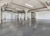 Thumbnail 85 of 92 - a large room with concrete floors and white walls