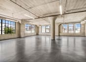 Thumbnail 75 of 92 - an empty room with large windows and a concrete floor
