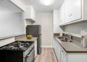 Thumbnail 2 of 28 - the preserve at ballantyne commons apartment kitchen with stove and sink