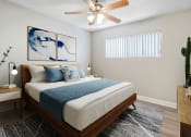 Thumbnail 16 of 28 - a bedroom with a white bed and a ceiling fan