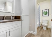 Thumbnail 17 of 28 - a bathroom with a sink and a toilet