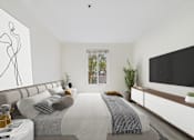 Thumbnail 13 of 41 - A modern bedroom with a large bed and a flat screen TV mounted on the wall.
