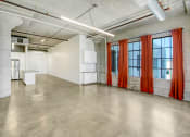 Thumbnail 30 of 92 - an empty room with white walls and orange curtains