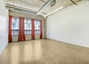 Thumbnail 31 of 92 - an empty room with windows and a red curtain