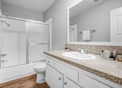 Thumbnail 37 of 65 - a bathroom with a sink and a shower and a toilet
