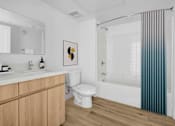 Thumbnail 40 of 69 - a bathroom with a toilet and a shower and a sink