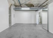 Thumbnail 47 of 92 - an empty room with a glass door and white walls