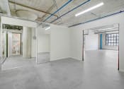 Thumbnail 48 of 92 - the interior of an empty room with white walls and glass doors