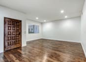 Thumbnail 70 of 88 - a bedroom with hardwood floors and white walls