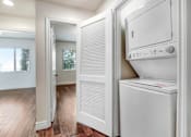 Thumbnail 78 of 88 - a washer and dryer in a room with a hardwood floor