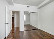Thumbnail 72 of 88 - a bedroom with hardwood floors and white walls