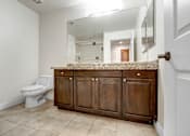 Thumbnail 81 of 88 - a bathroom with a toilet and a sink