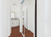 Thumbnail 20 of 46 - A bathroom with a mirror and sink.